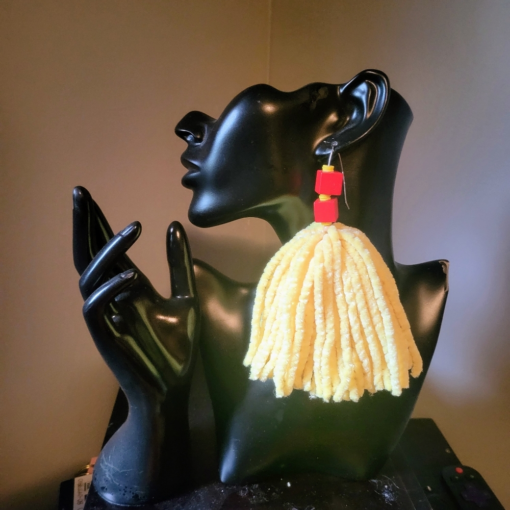 Handmade yarn drop earrings.